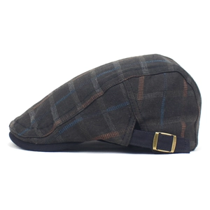Detail of vintage brown plaid beret with blue stripes and adjustable metal side buckle
