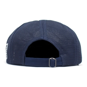 Detail view of breathable navy mesh back with adjustable metal buckle on newsboy cap