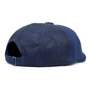 Detail view of breathable navy blue mesh back and adjustable metal buckle on newsboy cap