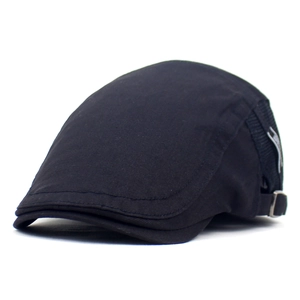 Detail view of the black newsboy cap featuring a side strap and silver metal buckle