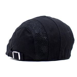 Detail view of the black mesh beret cap showing the silver metal adjustable buckle