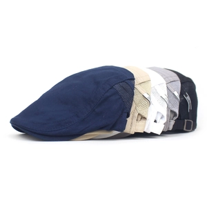 Detailed side view of stackable men's cotton beret caps featuring breathable mesh panels
