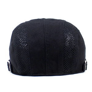 Detail of black ivy cap showing breathable mesh panels and side metal adjustment buckle