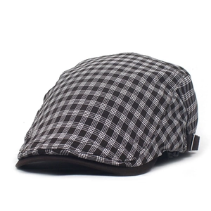 British style plaid flat cap with brown visor and adjustable metal buckle on white background