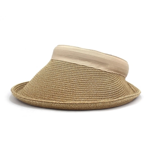 Close-up of a women's straw sun visor with fine woven texture and fabric edging trim