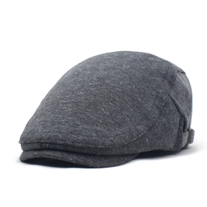 Classic dark grey beret flat cap with adjustable strap and knitted texture on white background