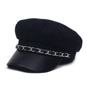 Black wool baker boy hat with a faux leather brim and a decorative silver chain detail