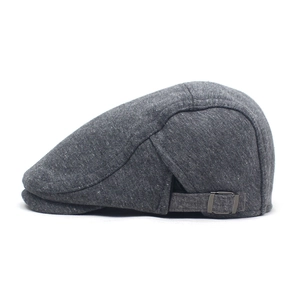 Detail of adjustable metal buckle and heather grey fabric texture on the flat cap