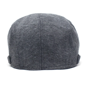 Detail of adjustable side buckles and dark gray knit texture on flat cap