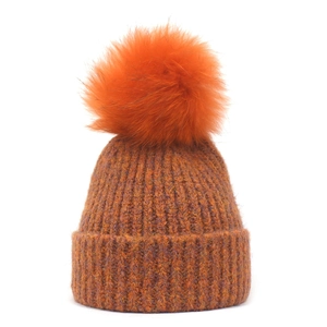 Orange and purple knit beanie with large faux fur pompom and ribbed cuff for winter