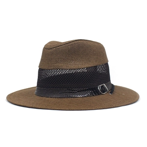 Detail view of brown straw sun hat with black mesh ventilation and faux snakeskin band