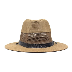 Detail view of khaki straw hat featuring breathable mesh crown and black faux-leather band