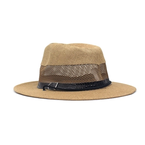 Detail of summer straw hat featuring breathable mesh crown and crocodile textured leather band