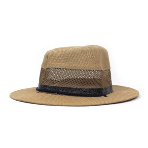 Detail of breathable mesh on summer wide brim straw hat with crocodile pattern leather band
