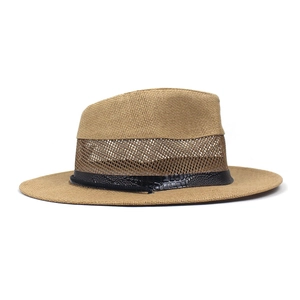 Detail view of khaki straw fedora with breathable mesh band and faux leather strap