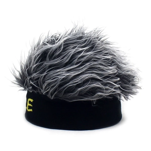 Close-up of black knit wig beanie featuring gray long hair and yellow SMILE embroidery