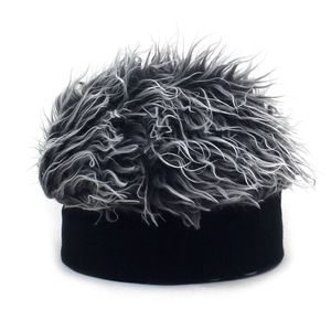 Detailed view of the gray and white curly wig texture on a black knit landlord cap