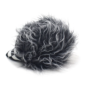 Detailed view of the fuzzy long plush texture and black and white striped knit brim