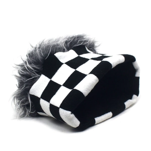Macro detail of checkered knit pattern with thick grey faux fur lining for winter warmth