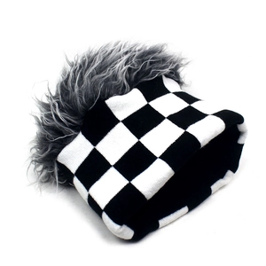 Close-up of checkerboard knit beanie with fuzzy grey wig trim for a unique street style