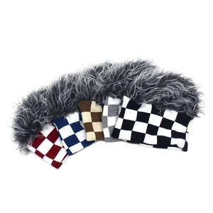 Detail of checkered knit headbands with thick gray faux fur in multiple colors