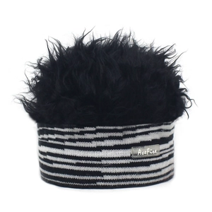 Macro detail of zebra pattern knit headband with fluffy black plush wig material