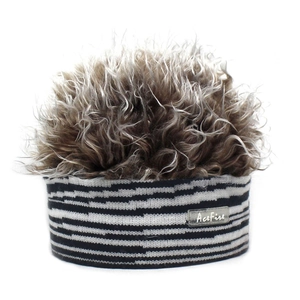Detail of Acefire beanie featuring zebra stripe knit band and fluffy faux fur top hair