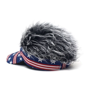 Detail of visor hat featuring USA flag stars and stripes with grey synthetic hair wig