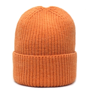 Detailed view of the bright orange knit beanie with a thick ribbed texture and wide cuff