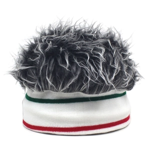 Close-up of knit white headband with red and green stripes featuring shaggy grey faux hair
