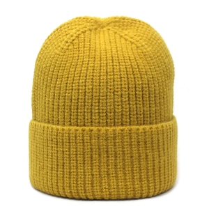 Detailed rib-knit texture of a warm ginger yellow beanie with wide folded cuff