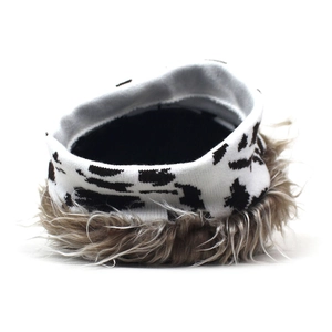 Detail of zebra pattern knit neck gaiter with thick brown faux fox fur lining for winter