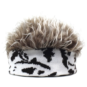 Macro detail of cow print knit headband with fluffy brown faux hair top for wig hat