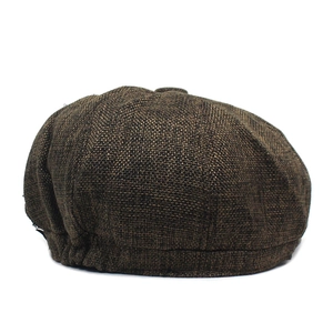 Detail view of coffee brown octagonal hat showing retro woven fabric texture and elastic band