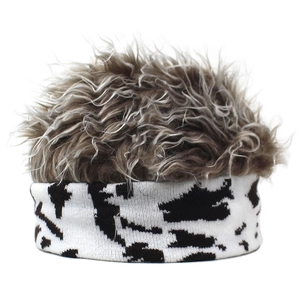 Detailed macro view of the fluffy taupe faux fur top and spotted knit headband texture