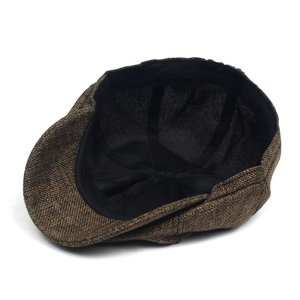 Detail of the inner lining and black sweatband of the brown textured ivy cap
