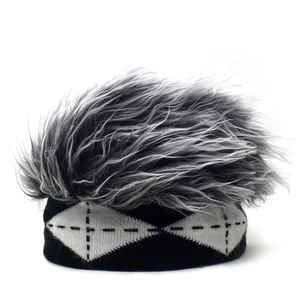 Detailed knit texture and dense grey faux fur on a black and white checkered beanie