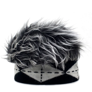 Detailed close-up of novelty beanie with grey faux fur hair and geometric knit pattern
