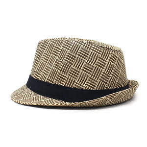 Detail of breathable khaki straw fedora showing woven texture and black grosgrain ribbon band
