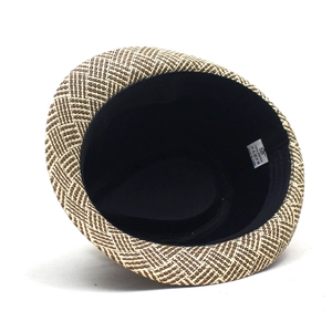 Detail view of woven paper sun hat interior showing size 58 label and sweatband