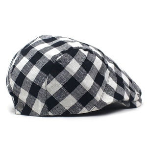 Detail of British style black and white plaid pattern and fabric texture on ivy cap