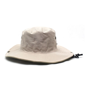 Detail of khaki wide brim sun hat showing metal eyelets and adjustable chin strap