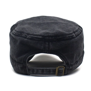 Detail of adjustable metal buckle and washed cotton texture on a vintage military cap