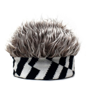Detail of grey faux fur hair top and black white geometric knit stripe on beanie hat