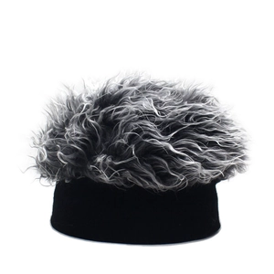 Detail view of beanie hat featuring thick grey synthetic hair with black knitted base
