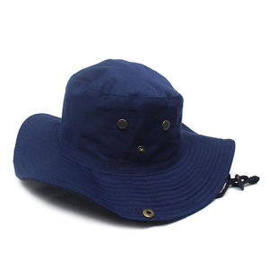 Detail of dark blue wide brim sun hat with metallic vents and adjustable chin strap