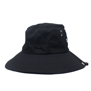 Detail of wide brim sun hat with breathable metal eyelets and adjustable chin drawstring