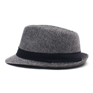 Detail view of breathable grey straw trilby hat featuring a classic black decorative ribbon