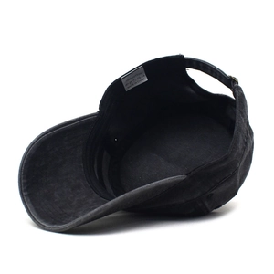 Detail view of cotton army cap interior showing the 100% cotton wash label and fabric texture