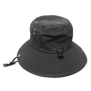 Detail of dark green wide-brim sun hat showing metal vents and adjustable wind cord